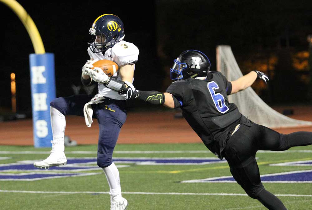 Unionville's J.T. Hower comes down with the first of his two interceptions in the game. Jim Gill photo.
