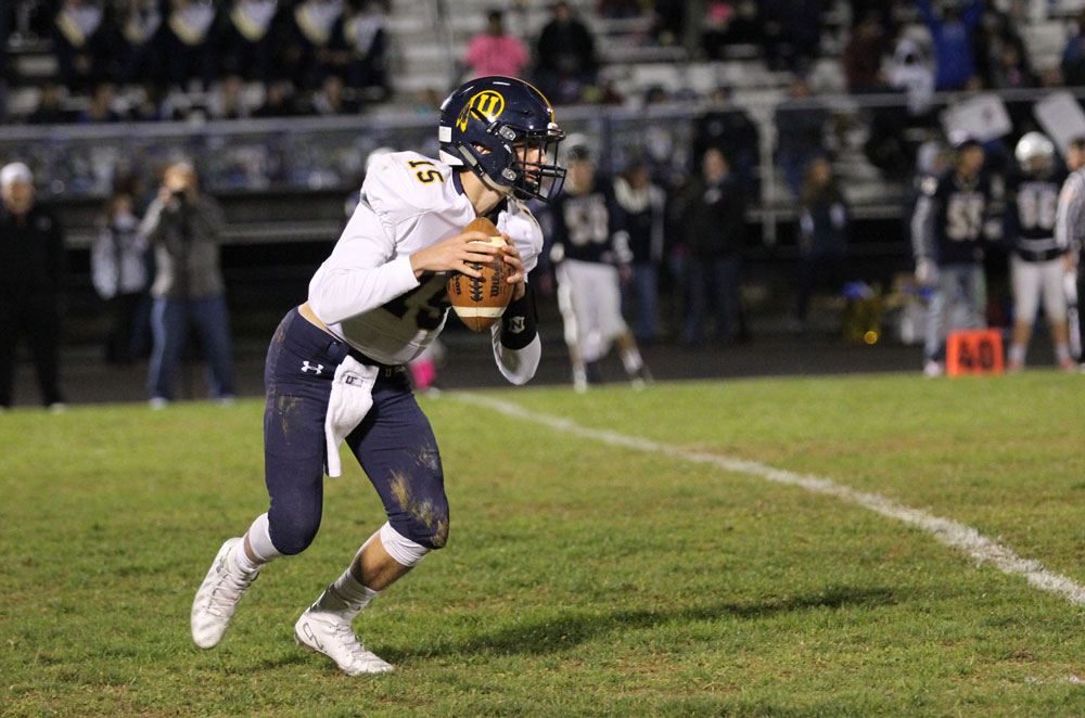 Unionville quarterback Alex Gorgone looks down field just before unleashing a long TD pass to JT Hower. Jim Gill photo.