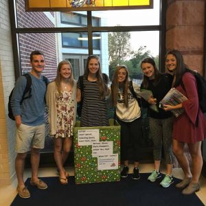 Unionville High School students Zach Kennedy, Taylor Nichols, Lainey Crosley, Francesca DiPlacido, Katy Frey, Elizabeth Koehler help kick off the annual Unionville-Chadds Ford Coat Drive.